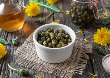 False capers made from dandelion buds in a bowl on a table